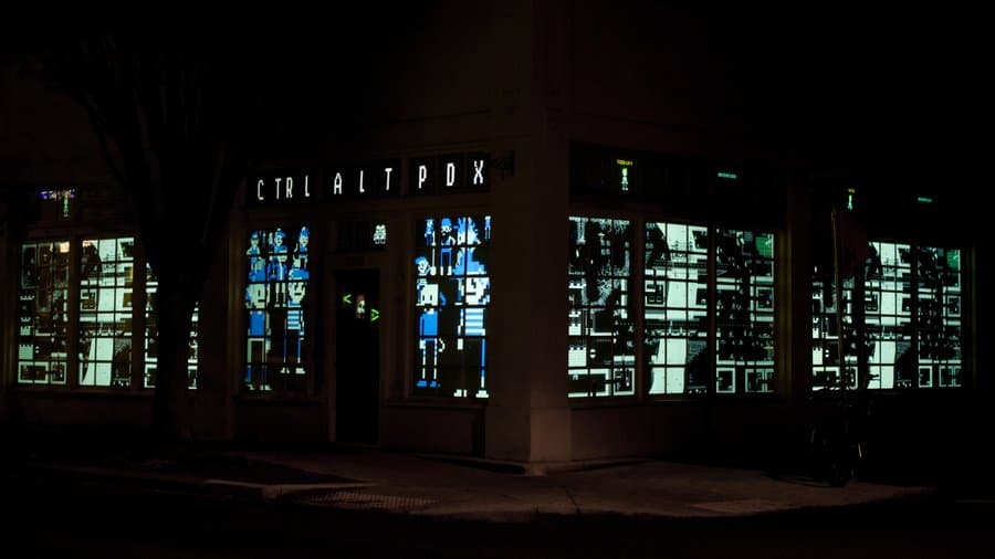 Storefront site of CTRL ALT PDX installation during the nighttime